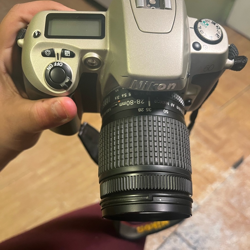 Black and grey Nikon film camera